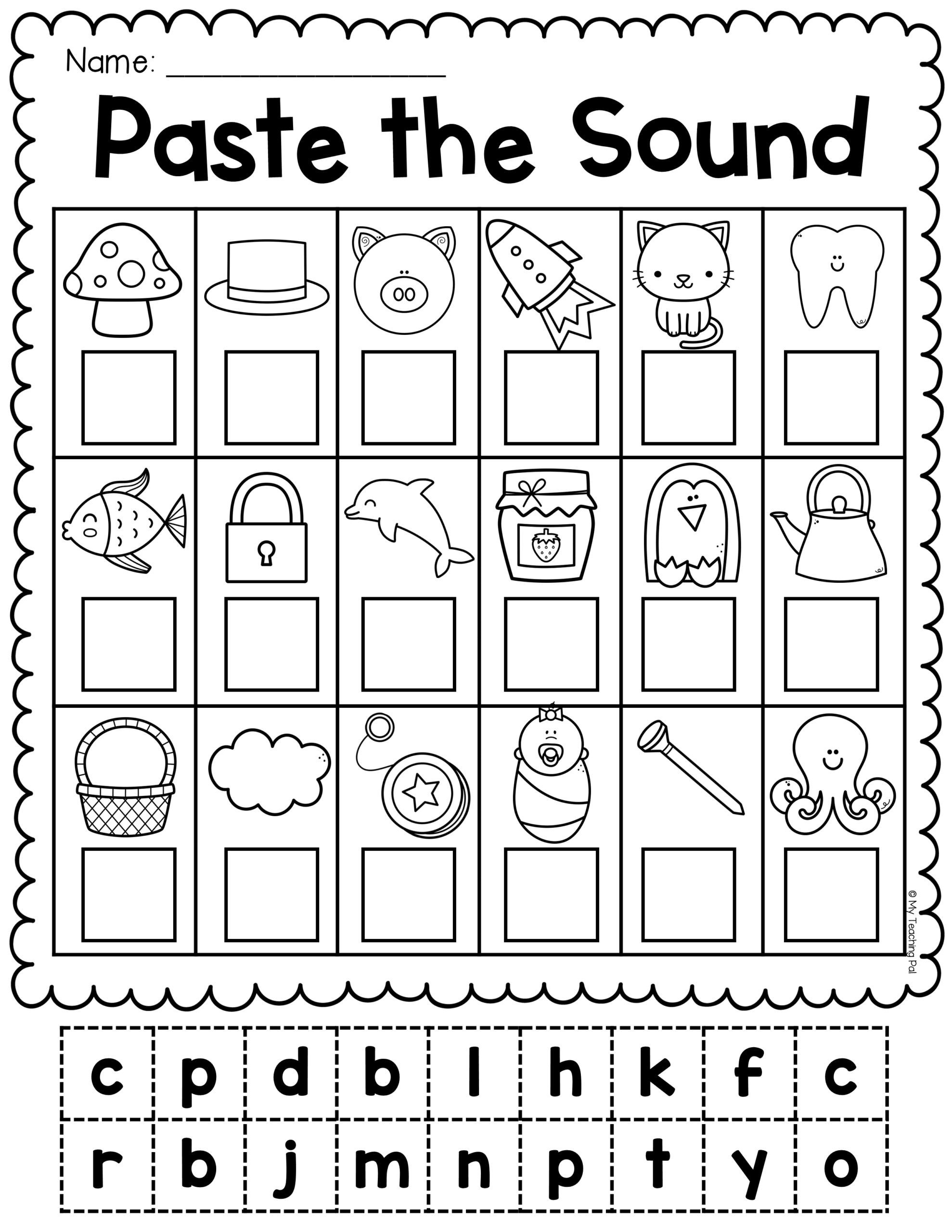 A close-up of a teacher reviewing a phonics worksheet with a student